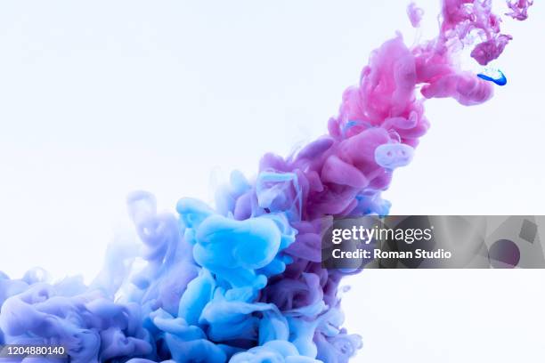 colorful ink swirling in water. colored paint. abstract color explosion - computerausdruck stock-fotos und bilder