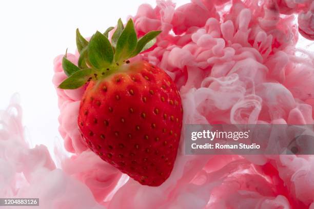 strawberries and milk under water. cream splash. abstract strawberry yogurt. coloured ink swirling in water. - juicy strawberry stock pictures, royalty-free photos & images