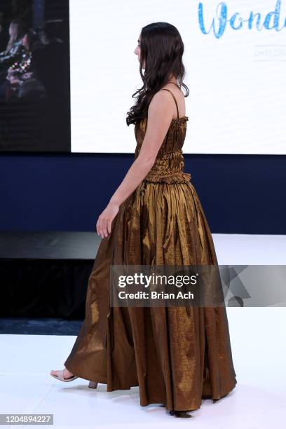 Model walks the runway wearing Wonderland Childrenswear during NYFW Powered By hiTechMODA on February 08, 2020 in New York City.