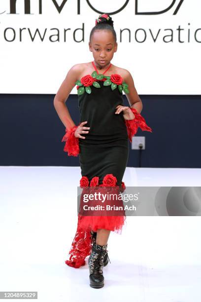 Model walks the runway wearing Glam2Glo Designz during NYFW Powered By hiTechMODA on February 08, 2020 in New York City.