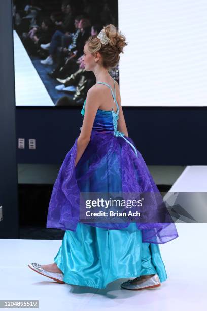 Model walks the runway wearing Marie Belle Couture during NYFW Powered By hiTechMODA on February 08, 2020 in New York City.