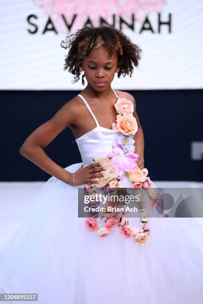 Model walks the runway wearing Marie Belle Couture during NYFW Powered By hiTechMODA on February 08, 2020 in New York City.