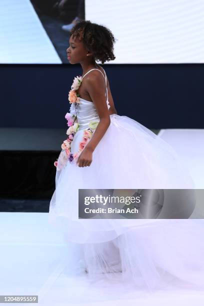 Model walks the runway wearing Marie Belle Couture during NYFW Powered By hiTechMODA on February 08, 2020 in New York City.