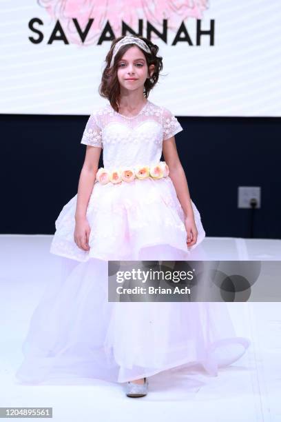 Model walks the runway wearing Marie Belle Couture during NYFW Powered By hiTechMODA on February 08, 2020 in New York City.