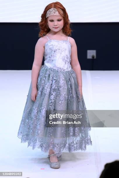 Model walks the runway wearing Marie Belle Couture during NYFW Powered By hiTechMODA on February 08, 2020 in New York City.