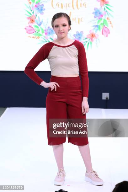 Model walks the runway wearing Camellia Couture during NYFW Powered By hiTechMODA on February 08, 2020 in New York City.