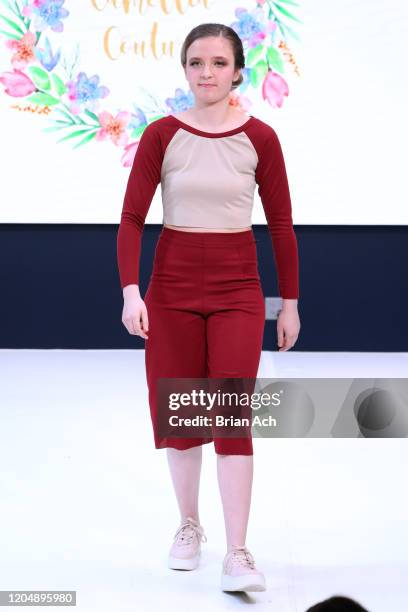 Model walks the runway wearing Camellia Couture during NYFW Powered By hiTechMODA on February 08, 2020 in New York City.