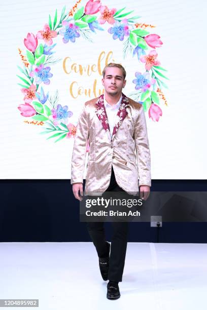 Model walks the runway wearing Camellia Couture during NYFW Powered By hiTechMODA on February 08, 2020 in New York City.