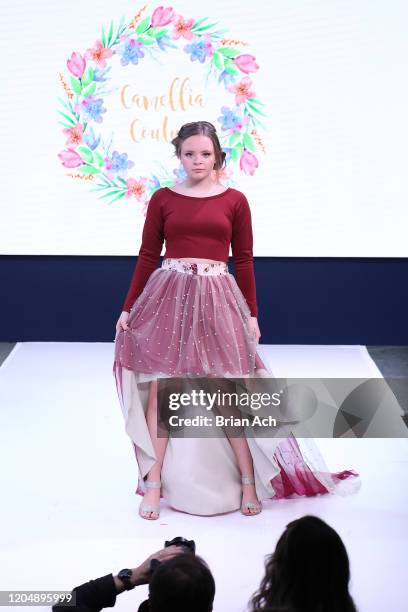 Model walks the runway wearing Camellia Couture during NYFW Powered By hiTechMODA on February 08, 2020 in New York City.