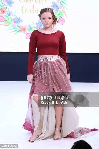 Model walks the runway wearing Camellia Couture during NYFW Powered By hiTechMODA on February 08, 2020 in New York City.