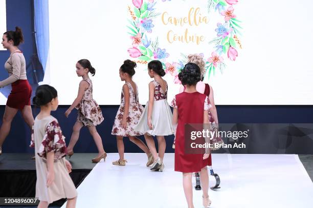 Model walks the runway wearing Camellia Couture during NYFW Powered By hiTechMODA on February 08, 2020 in New York City.