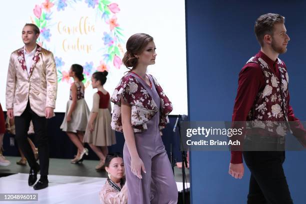 Model walks the runway wearing Camellia Couture during NYFW Powered By hiTechMODA on February 08, 2020 in New York City.