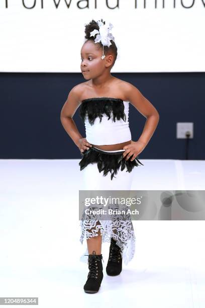 Model walks the runway wearing Glam2Glo Designz during NYFW Powered By hiTechMODA on February 08, 2020 in New York City.