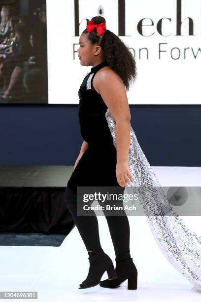 Model walks the runway wearing Glam2Glo Designz during NYFW Powered By hiTechMODA on February 08, 2020 in New York City.