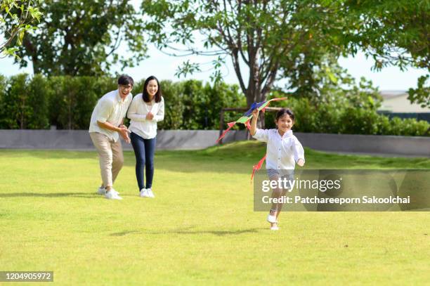 family spending time together - thailand kite stock-fotos und bilder