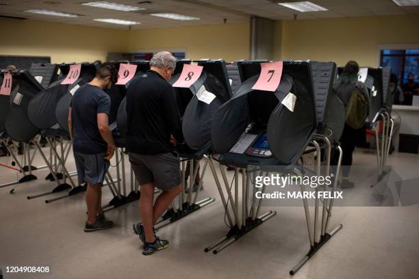 Voters cast their ballots during the presidential primary in Houston, Texas on Super Tuesday, March 3, 2020. Fourteen states and American Samoa are...