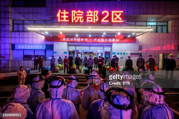 Patients infected by the COVID-19 coronavirus wait to be transferred from Wuhan No.5 Hospital to Leishenshan Hospital, the newly-built hospital for...