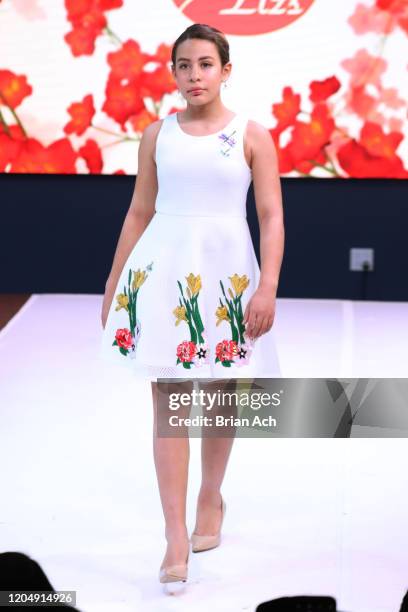 Model walks the runway wearing Bebe's and Liz's presents MODA Models during NYFW Powered By hiTechMODA on February 08, 2020 in New York City.