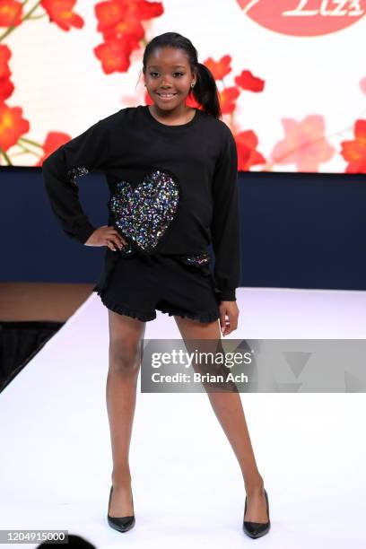 Model walks the runway wearing Bebe's and Liz's presents MODA Models during NYFW Powered By hiTechMODA on February 08, 2020 in New York City.