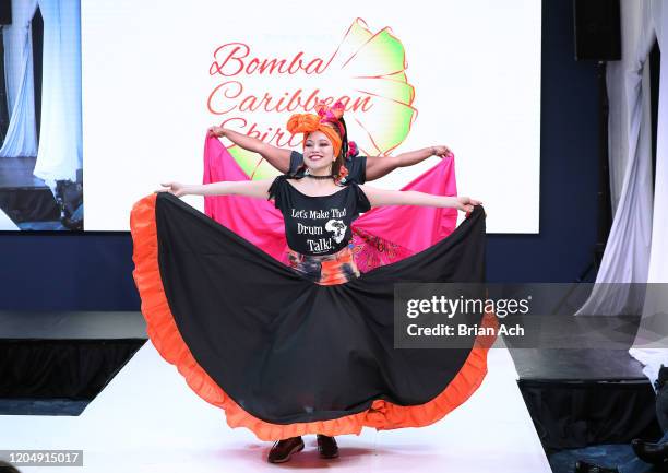 Model walks the runway wearing Bombazo Wear Bomba Carribbean Skirts during NYFW Powered By hiTechMODA on February 08, 2020 in New York City.