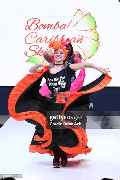 Model walks the runway wearing Bombazo Wear Bomba Carribbean Skirts during NYFW Powered By hiTechMODA on February 08, 2020 in New York City.