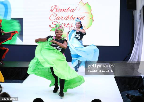 Model walks the runway wearing Bombazo Wear Bomba Carribbean Skirts during NYFW Powered By hiTechMODA on February 08, 2020 in New York City.