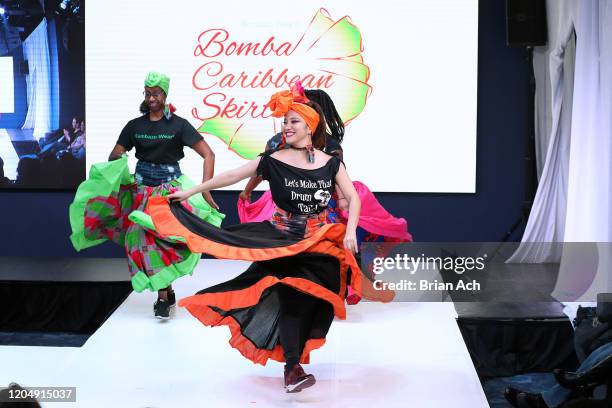 Model walks the runway wearing Bombazo Wear Bomba Carribbean Skirts during NYFW Powered By hiTechMODA on February 08, 2020 in New York City.