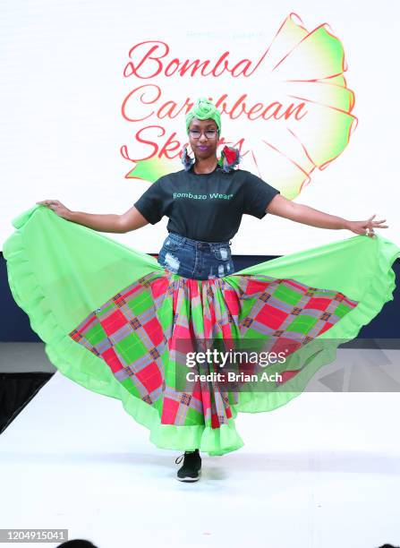 Model walks the runway wearing Bombazo Wear Bomba Carribbean Skirts during NYFW Powered By hiTechMODA on February 08, 2020 in New York City.