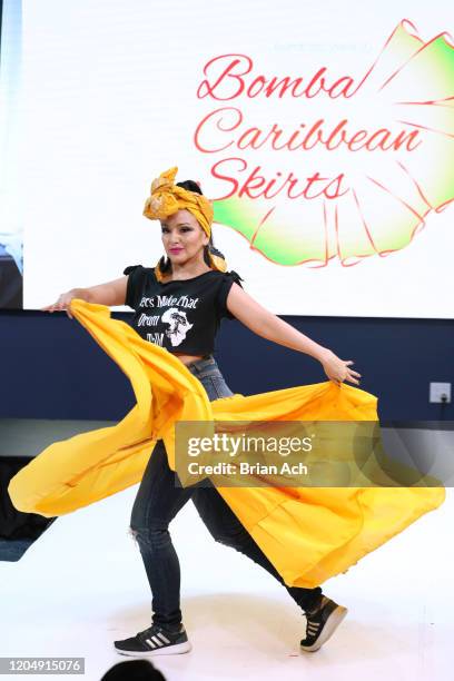 Model walks the runway wearing Bombazo Wear Bomba Carribbean Skirts during NYFW Powered By hiTechMODA on February 08, 2020 in New York City.