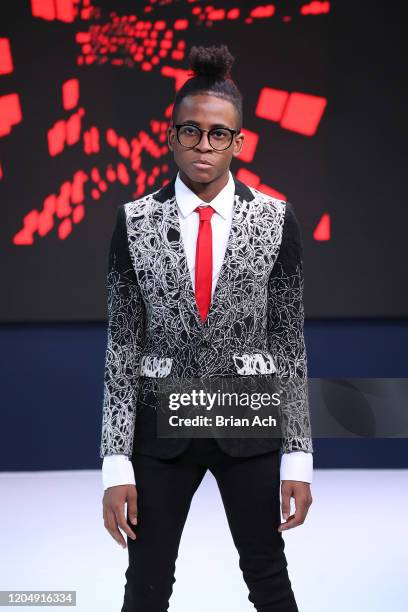 Model walks the runway wearing CHINO' ARTE' BY WAYNE during NYFW Powered By hiTechMODA on February 08, 2020 in New York City.