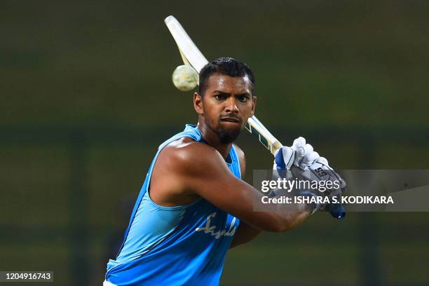 West Indies' Nicholas Pooran plays a shot during a practice session at the Pallekele International Cricket Stadium in Kandy on March 3 ahead of the...