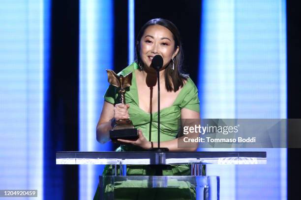 Lulu Wang accepts the Best Supporting Female award for 'The Farewell' on behalf of winner Zhao Shuzhen onstage during the 2020 Film Independent...