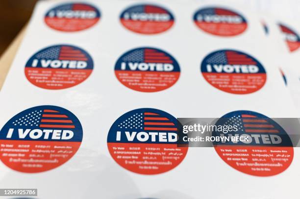 Voted" stickers are seen at a voting center during the presidential primary vote in Glendale, California on Super Tuesday, March 3, 2020. Fourteen...