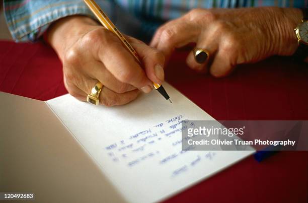 woman writing letter - message stock-fotos und bilder