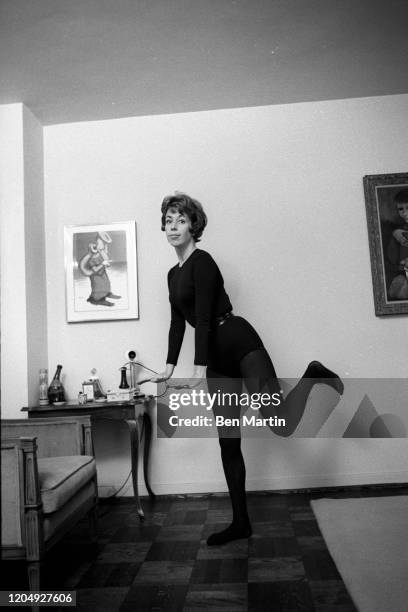 American actress, comedian, singer, and writer Carol Burnett clowning in her New York apartment, May 1963.