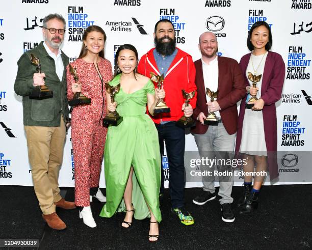 Peter Saraf, Daniele Tate Melia, Lulu Wang, Andrew Miano, a guest, and Anita Gou, winners of Best Feature for "The Farewell," pose in the press room...