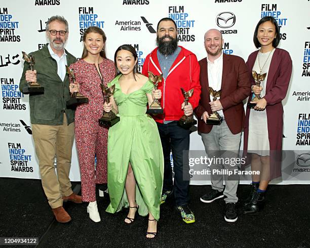 Peter Saraf, Daniele Tate Melia, Lulu Wang, Andrew Miano, a guest, and Anita Gou, winners of Best Feature for "The Farewell" pose in the press room...