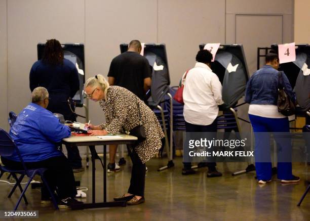 Voters cast their ballots during the Democratic presidential primary in Houston, Texas on Super Tuesday, March 3, 2020. Fourteen states and American...