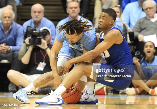 Cole Anthony of the North Carolina Tar Heels battles for a loose ball with Cassius Stanley of the Duke Blue Devils during their game at Dean Smith...