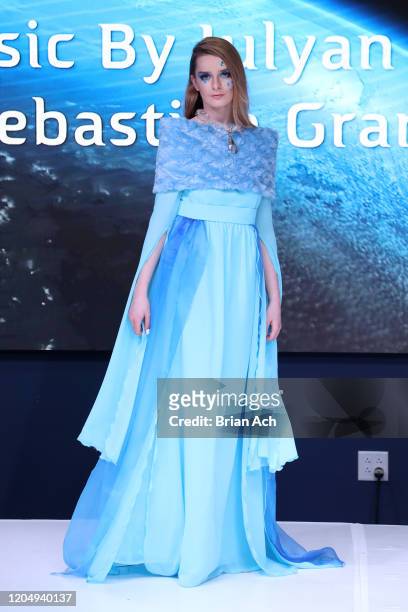 Model walks the runway wearing dkDesign Fashion during NYFW Powered By hiTechMODA on February 08, 2020 in New York City.