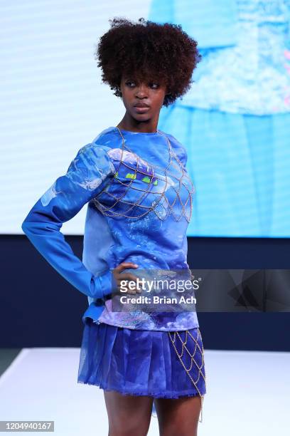 Model walks the runway wearing dkDesign Fashion during NYFW Powered By hiTechMODA on February 08, 2020 in New York City.