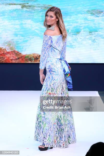 Model walks the runway wearing dkDesign Fashion during NYFW Powered By hiTechMODA on February 08, 2020 in New York City.