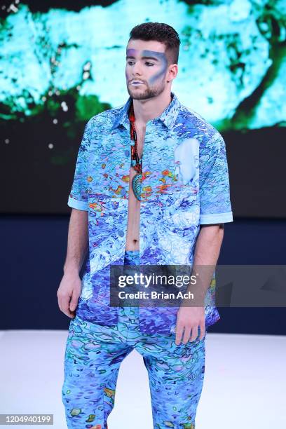 Model walks the runway wearing dkDesign Fashion during NYFW Powered By hiTechMODA on February 08, 2020 in New York City.