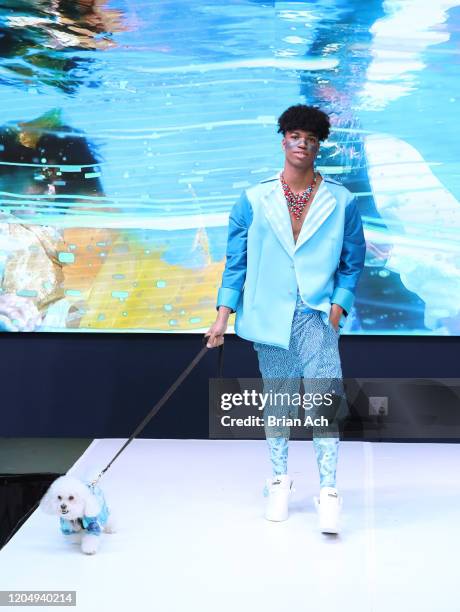 Model walks the runway wearing dkDesign Fashion during NYFW Powered By hiTechMODA on February 08, 2020 in New York City.