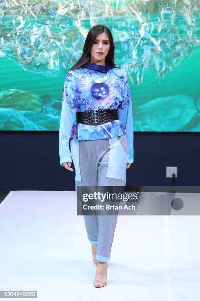 Model walks the runway wearing dkDesign Fashion during NYFW Powered By hiTechMODA on February 08, 2020 in New York City.