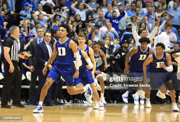 Tre Jones of the Duke Blue Devils reacts after making a shot at the end of regulation to send the game to overtime against the North Carolina Tar...