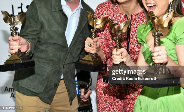 Peter Saraf, Daniele Tate Melia, and Lulu Wang, trophY detail, winners of Best Feature for "The Farewell," pose in the press room at the 2020 Film...