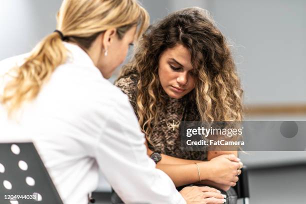girl frustrated in a counseling session stock photo - bad habit stock pictures, royalty-free photos & images