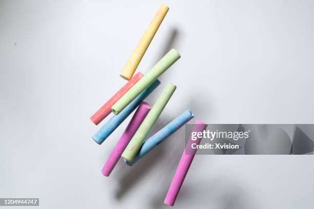 colorful chalk flying with white background sync in high speed - chalk sticks stock pictures, royalty-free photos & images