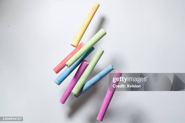 colorful chalk flying with white background sync in high speed - high sticking stock pictures, royalty-free photos & images